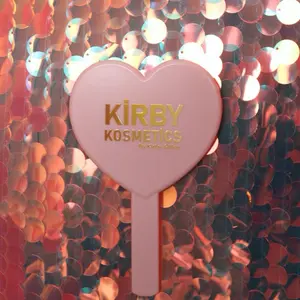 Kirby Kosmetics The Konfident Mirror with Heart-Shaped Design and Stylish Label