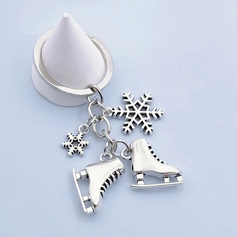 Winter Sports Keychain, Fashionable Alloy Keychain - Ice Skate & Snowflake Charm with Metallic Finish, Durable Alloy Construction - Gift for Figure Skaters, Hockey Players, Cold Weather Athletes - Sports Enthusiast Accessory, Skater Gifts