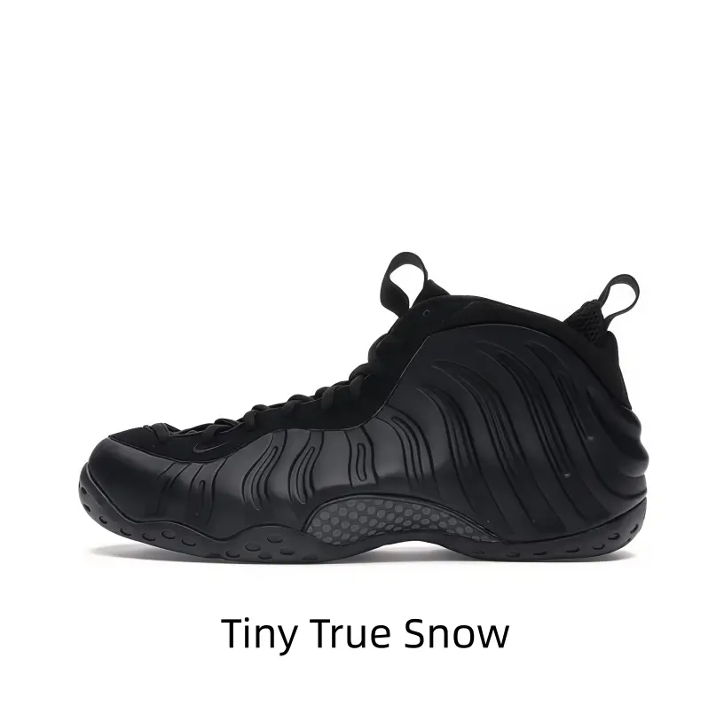Essential minimalist mid-top sneakers featuring sleek all-black molded shell and textured rubber outsole, curved wave shell structure plus honeycomb cushion midsole balance understated appearance and daily practical performance