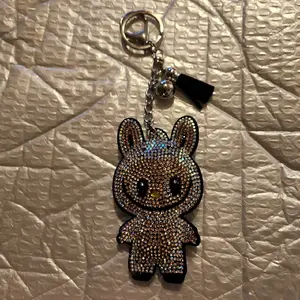 Shiny Bubu Keychain with Sparkly Details and Metal Ring for Key Storage and Organization