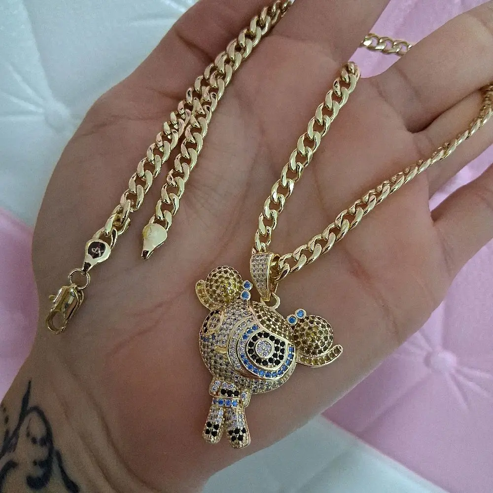 5.5 mm cuban chain 16 inches long with small yelow ,blue and gold   carton pandant, 14 kgold plated