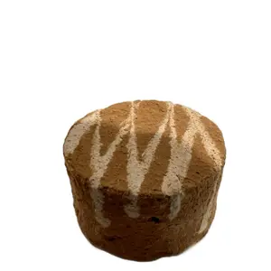 D- CRUJIDOS Bocado canela. Brown and white Clay in a form of a circle. Made in Mexico