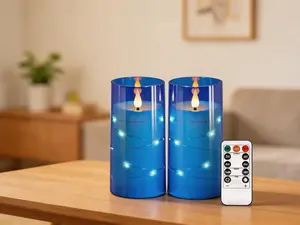 2-pack blue flameless LED candles with 3D wick and star string lights. Battery-operated with remote and timer, perfect for wedding and holiday decor.