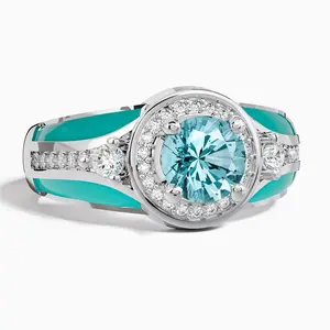 A modern, affordable luxury enamel wide-band ring featuring a plump, translucent synthetic aquamarine. Finished with turquoise-colored enamel, this ring exudes a vintage artisanal charm. Its unisex design makes it an exquisite gift for the holidays.