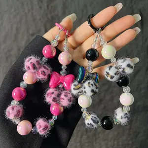 Leopard print hairball bow beaded mobile phone chain short mobile phone case bracelet lanyard wrist keychain bag chain cute charm anti-lost phone lanyard