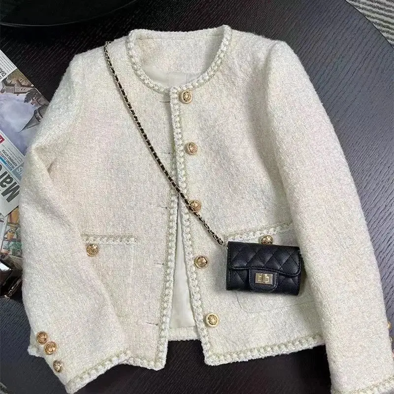 White tweed jacket with gold button