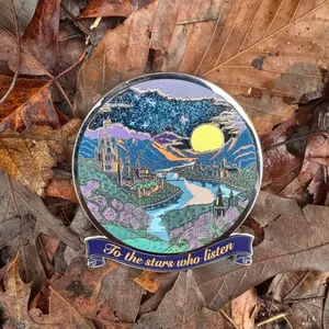 ACOTAR Velaris Quicksand Pin - Circular Design Featuring Fantasy Landscape and "To the Stars Who Listen" Text