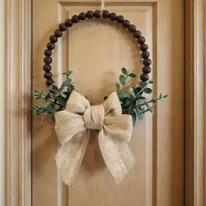 Pendant decorations, vintage-style bow embellishments, simple dark wood bead decorations. Bow and eucalyptus leaf combination decorations for use in entryways, living rooms, bedrooms, walls, outdoor facades, and decorative hangings.