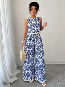 Elegant Chic Two-Piece Set, Sleeveless Top with Ruffle Details, Wide-Leg Pants, Printed Design, Perfect for Vacation Style