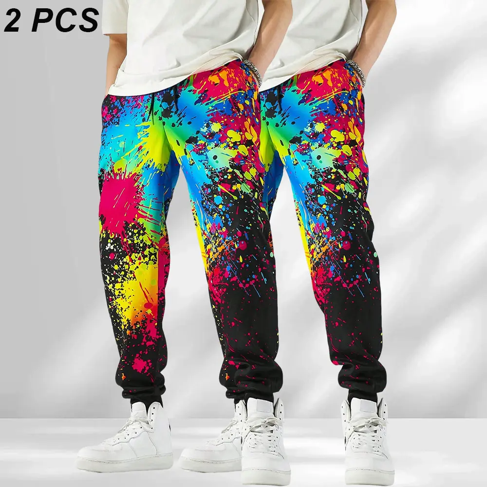 Men’s joggers with colorful paint-splatter print, street graffiti–style color-block design; loose fit that flatters the figure; casual athletic pants with a comfortable drawstring waist and jogger cuffs; suitable for everyday trendy outfits, streetwear, a