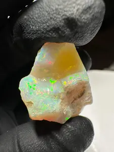 Jewelry Grade Rough with white base and green play of color or “fire” inc. color bar Opal