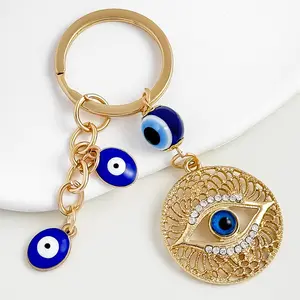 Diamond Simulant Evil Eye Keychain - Resin Base, Sparkly Gold Chain, Turkish Vibe, Blue-Eyed Design, Tassel Detail, Gold Fashion Accessory, Bag Charm for Bags, Bag Charms, Diamond Simulant Keychains