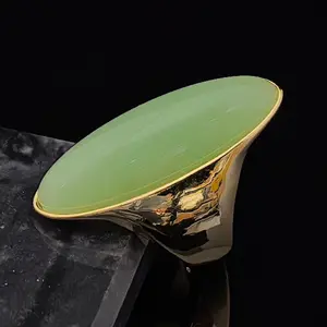 1 olive-shaped stainless steel ring in light green