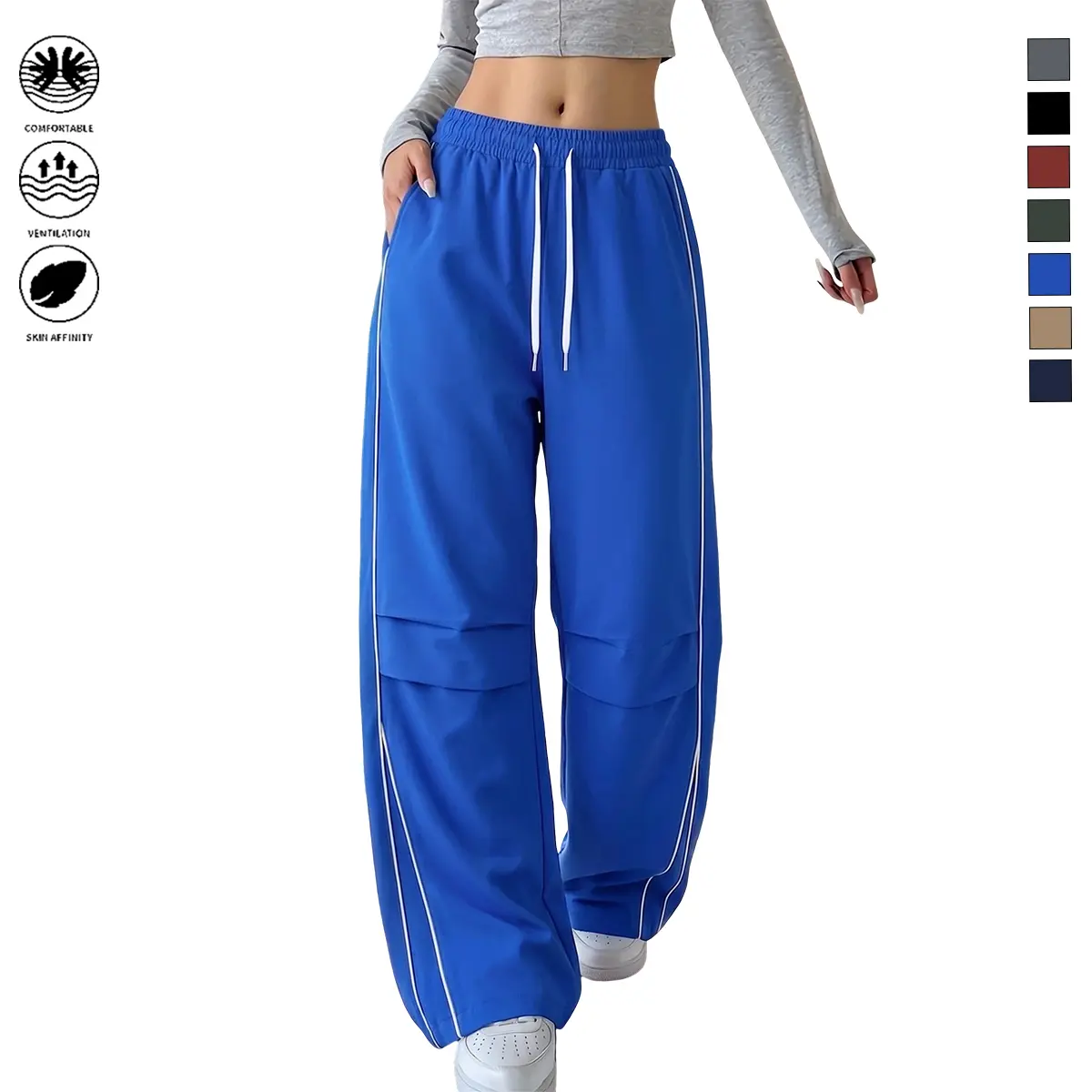 JOGWAVE women’s wide-leg cargo pants featuring asymmetrical striped arcs on both sides, an elastic waistband with drawstring, urban casual style, Y2K aesthetic, simple yet stylish.