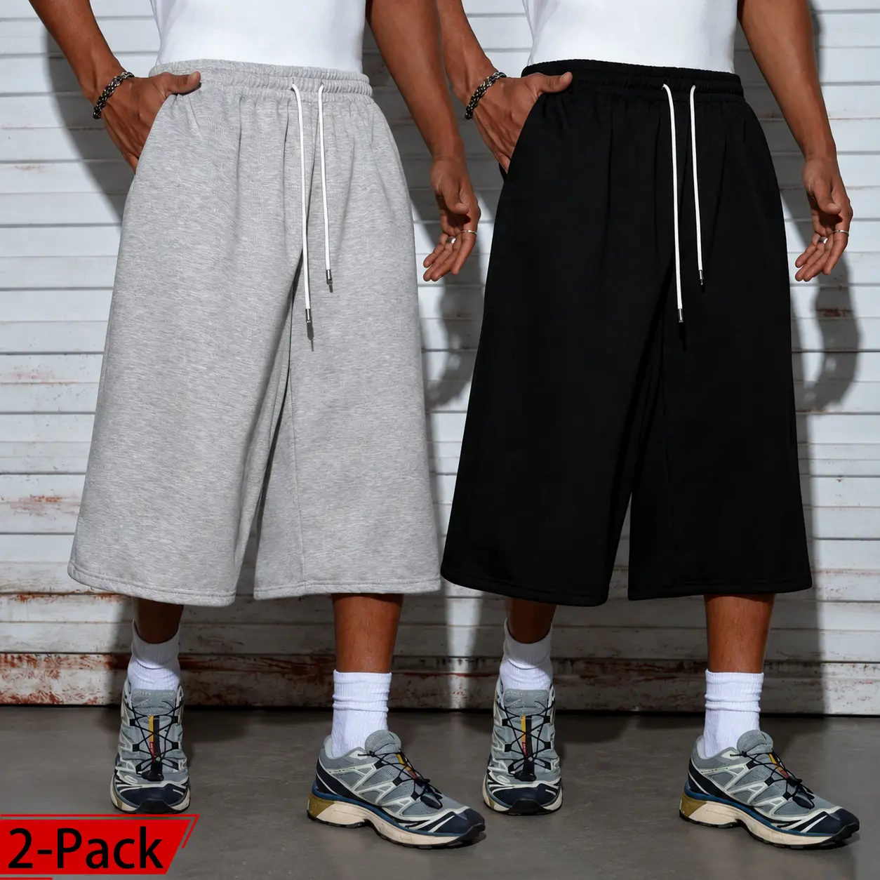 Men’s two-pack wide-leg shorts: loose capri style with a drawstring elastic waistband, casual street style, relaxed fit with pockets. Suitable for summer workouts and home wear; 7/8 length. Comfortable, breathable shorts—perfect for everyday casual wear.