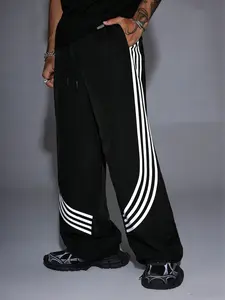 Unisex Y2K street style featuring color-block curved stripes, a wide-leg design, and a loose fit; suitable for skateboarding, fitness, and everyday wear; retro athletic streetwear with Balenciaga-inspired cuts; unisex sports pants, casual style.