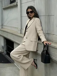 Solid light beige, patternedfree, Elegant clothing for women, Business Attire Clothes, consisting of a single-breasted, notchapel suit. The style is minimalist and suitable for daily commuting, caf dates, or light business meetings.