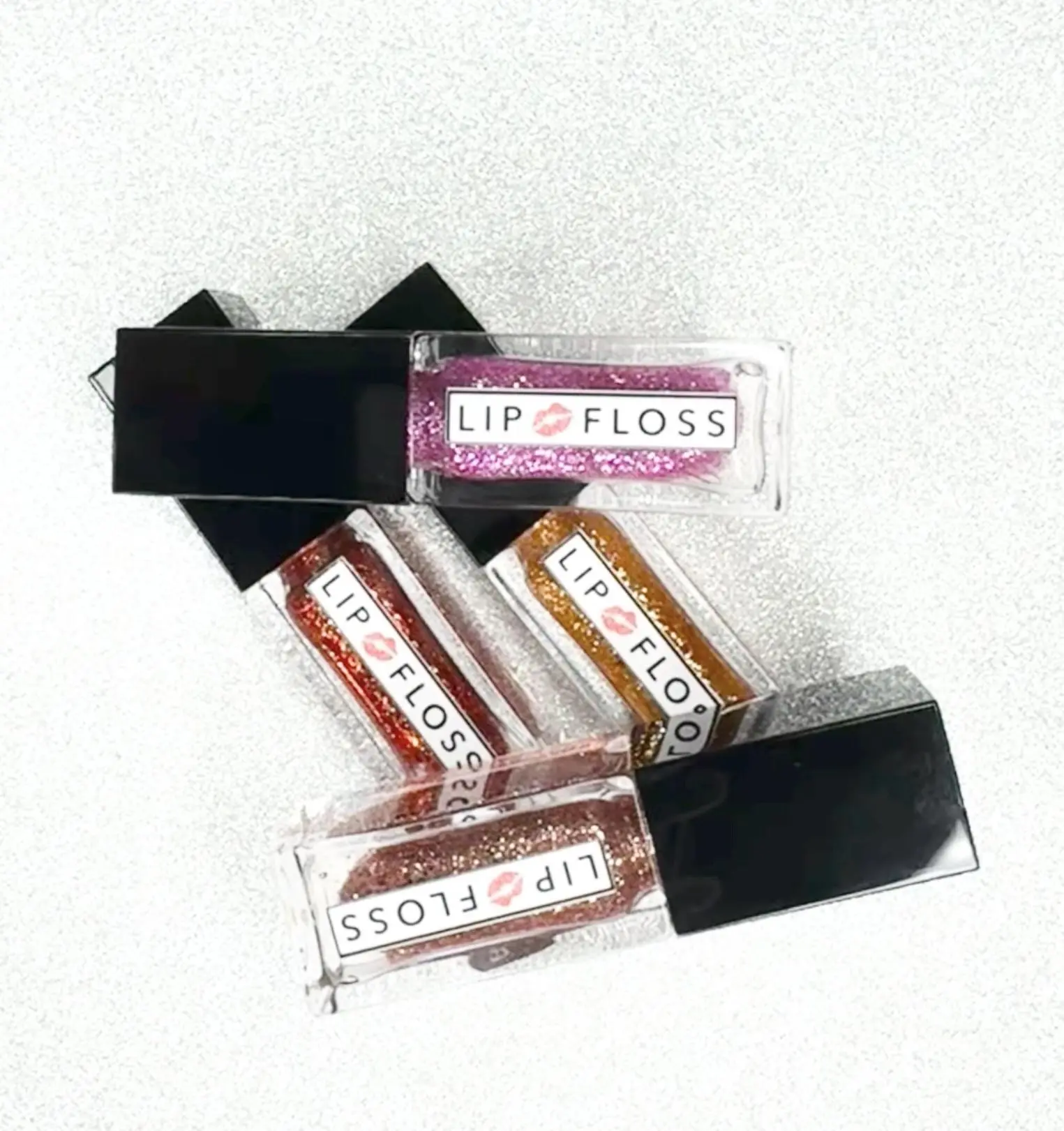 The Unforgettable Collection Rose Gold, Sunkist, Fiyah and Taffy Lip Floss High Shine lip gloss is a non-sticky formula enriched with shea butter and vitamin E to moisturize and soften lips. It provides a high-shine, lightweight, and long-lasting   4.5ml