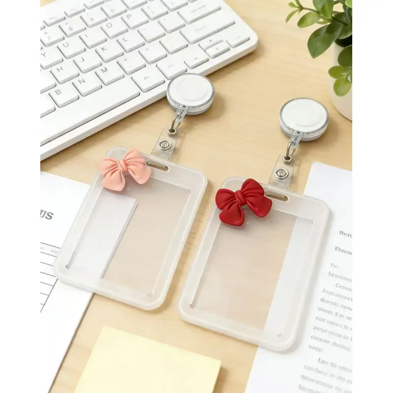 A transparent plastic card holder with a bow decoration and a retractable badge clip, a portable ID badge protector that can hold ID cards, credit cards. Badge Reels Retractable Clear Id Badge Holder, Id Badge Holders Retractable