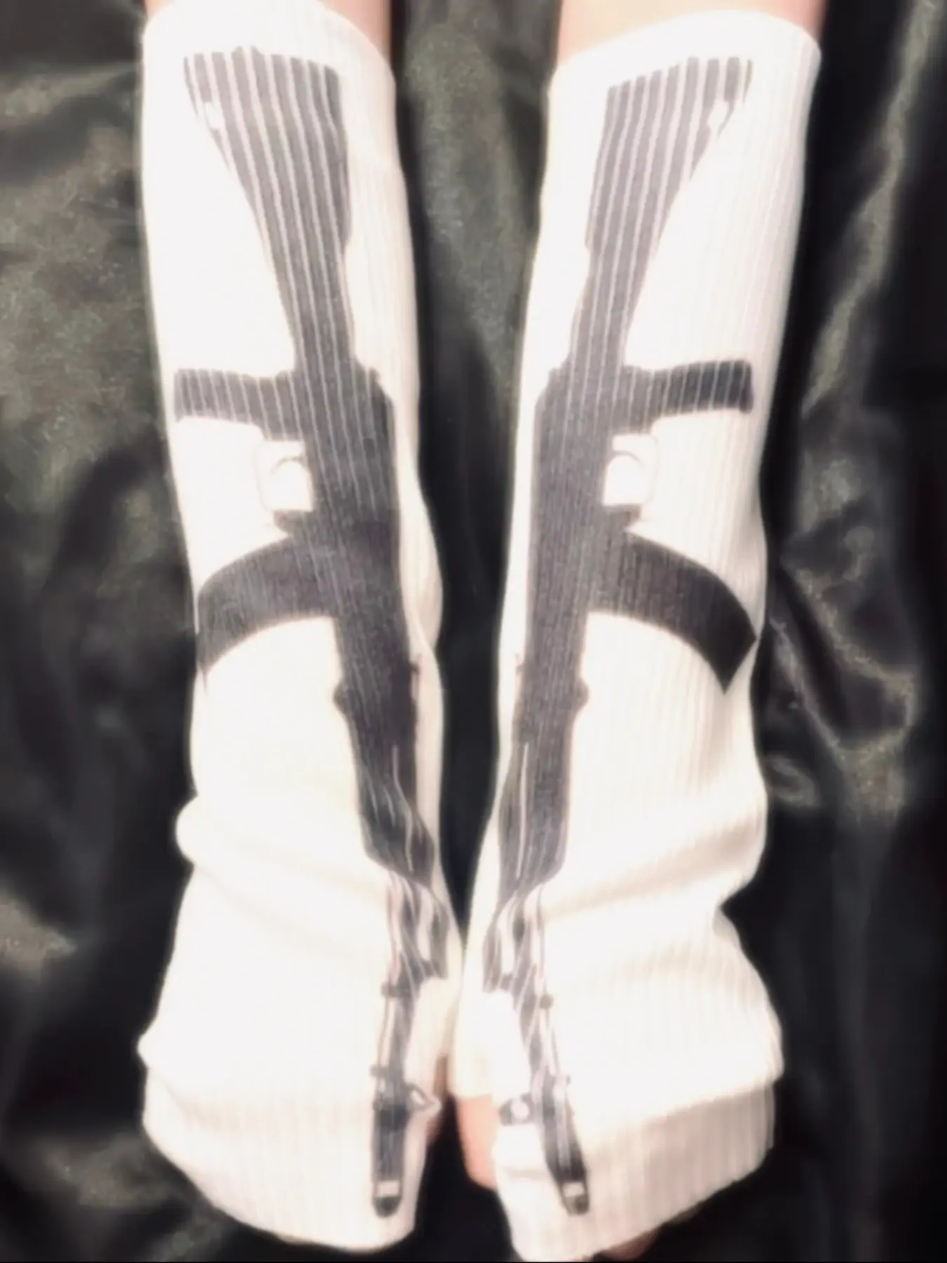 These Sweet & Savage long knit gloves feature an edgy gun print for a unique street style. Perfect for a steampunk inspired look or adding a rebellious touch Seamless knit gloves