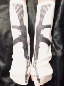 These Sweet & Savage long knit gloves feature an edgy gun print for a unique street style. Perfect for a steampunk inspired look or adding a rebellious touch Seamless knit gloves