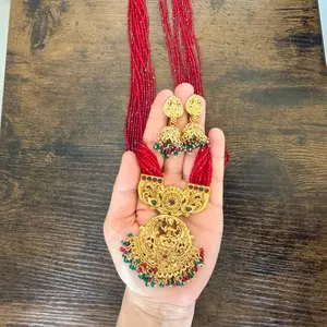 Brass made Temple Jewelry of goddess Laxmi pendant with Maroon Red long hydro potey on it with brass earrings, elegant design