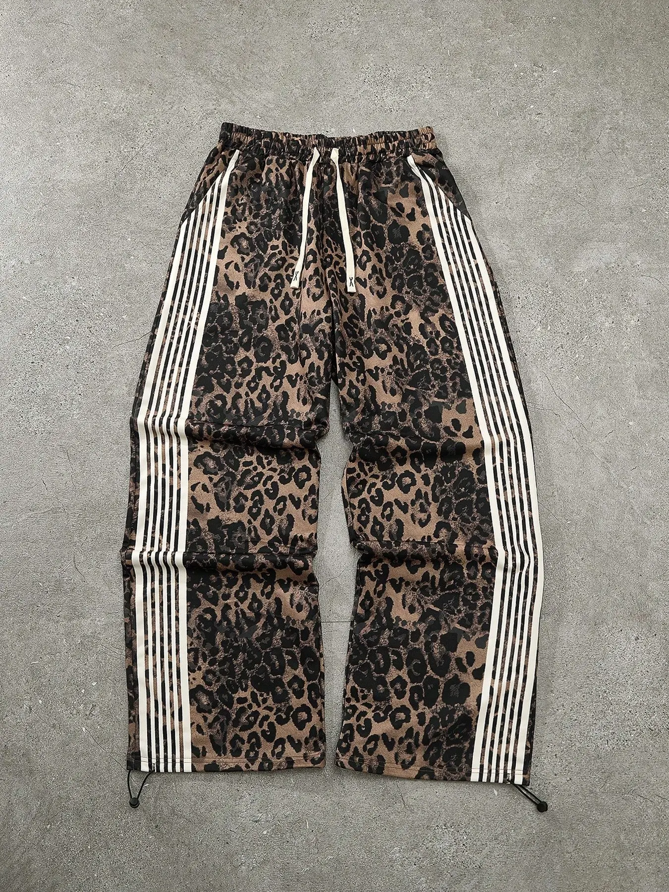 Unisex style, streetwear-inspired fashion striped and leopard-print Bold Patterns drawstring waistband joggers. A versatile summer fashion item that pairs well with various outfits. Stylish, trendy, hip-hop, sports, and hip-hop dance. Jogging Pants