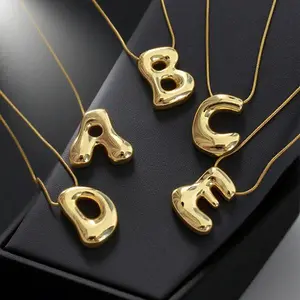 A new trendy irregular letter necklace for women, featuring a chunky 3D letter pendant and a stainless steel snake chain, perfect for versatile summer styling and gifting to girlfriends