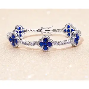 Paired with a 5A+ Sri Lankan Moissanite bracelet, featuring a four-leaf clover motif, colorful gemstone inlay, and a classic tennis chain design—crafted exclusively for women. This piece embodies a luxurious yet minimalist aesthetic, making it an ideal ch