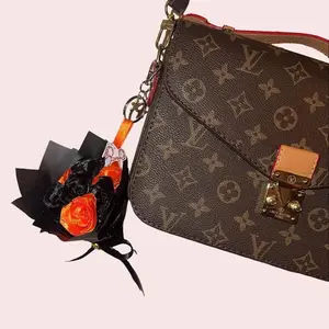 Bouquets By Maggie Rose Iván Cornejo mini bouquet keychain