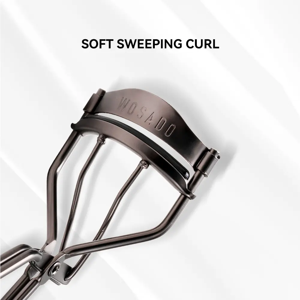 WOSADO Eyelash Curler Soft silicone pad prevents tugging or damage. Precision fit for all eyes. No pinching, just pro-level lift.