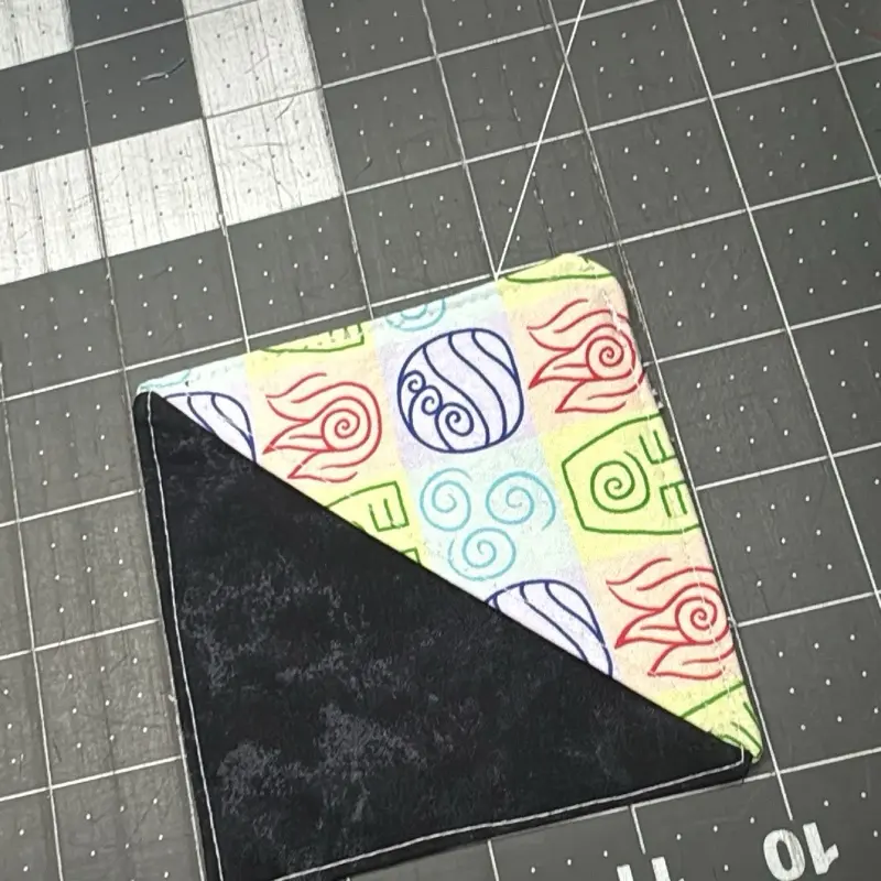 Fabric Bookmark with Colorful Swirl Design on Black Background