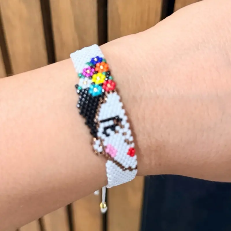 Beautiful half-face Frida Kahlo bracelets in white, pink, blue, and red.