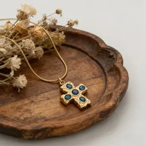 "Retro Gemstone Cross" Snake Chain Necklace: Featuring an antiqued, textured cross pendant set with natural iridescent gemstones, paired with a snake chain. An accessory that captures the essence of vintage charm combined with French elegance jewellery