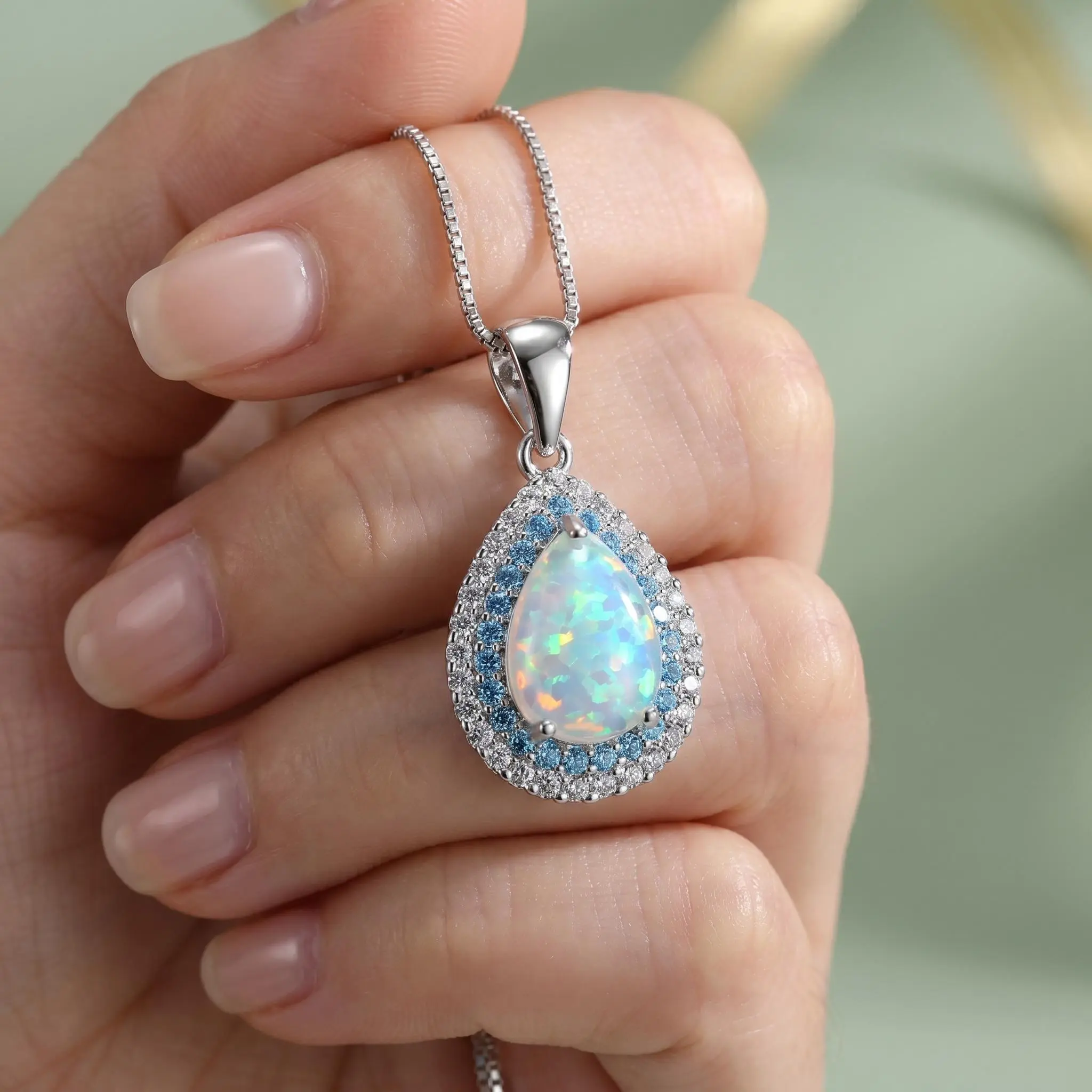 AAA-grade color-changing fire opal teardrop necklace with 925 sterling silver chain and dual aura effect; blue crystal pendant; low allergy risk; high-end jewelry—romantic birthday/anniversary gift for women, mothers, girlfriends, and wives. campingessent