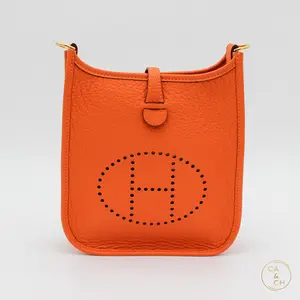 Pre-owned Hermès Taurillon Clemence Crossbody Bags Hermès Evelyne Mini 16 in Orange with gold hardware crossbody bag Hermes