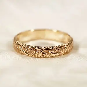 A vintage-style hand-carved plain band ring, featuring intricate vintage patterns engraved all over the band. It exudes a strong handcrafted feel with exquisite, three-dimensional details, embodying a Victorian court style—the perfect gift for her.