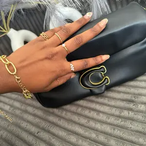 MINORITYBAG Stylish Gray Leather Crossbody Bag with Adjustable Strap and Gold Hardware for Everyday Use