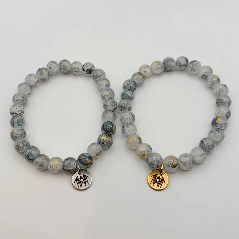 ST inspired glass bead bracelet gold gray with laser engraved sigil charm