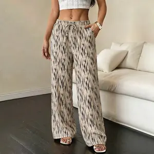 Women’s Bohemian water-drop texture loose wide-leg pants for summer—casual stretch fabric with a drawstring waist and side pockets; soft, lightweight, breathable, wrinkle-resistant, machine washable, with a drapey feel; suitable for music festivals, vacat