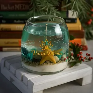 Viora Bloom Ocean Candle Handcrafted with crystal-clear jelly wax, seashells, and a gentle Blue Wind Chime scent — bringing the calm rhythm of the ocean to your home. Each piece is unique, evoking soft waves and coastal serenity   Eco-friendly | Handma
