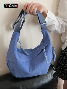 Lightweight pleated nylon crescent bag with woven tassel embellishments, Lightweight shoulder bag, versatile crossbody bag for work commutes, Zipper closure, Suitable for commuting, shopping, dates, and everyday accessories, Unique Bags