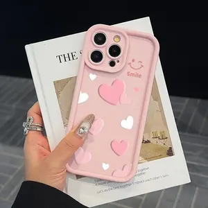 A pink phone case designed with a happy face and heart shape, suitable for iPhone 15 Pro Max, iPhone 16/14/13 Pro/12/11. It provides comprehensive protection and is a fashionable choice, perfect as a gift, especially for Valentine's Day