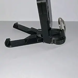 3D Printed Keychain Phone Stand with Textured Thumb Pad & Rotating Click Feature for Enhanced Grip and Stability