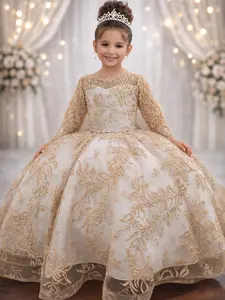 Doncella Champagne-colored dress with glitter details throughout the entire dress.