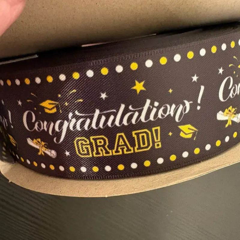 1.5” Congratulations GRAD Satin Ribbon - 50 yards 1.5” Congratulations GRAD Satin Ribbon - 50 yards