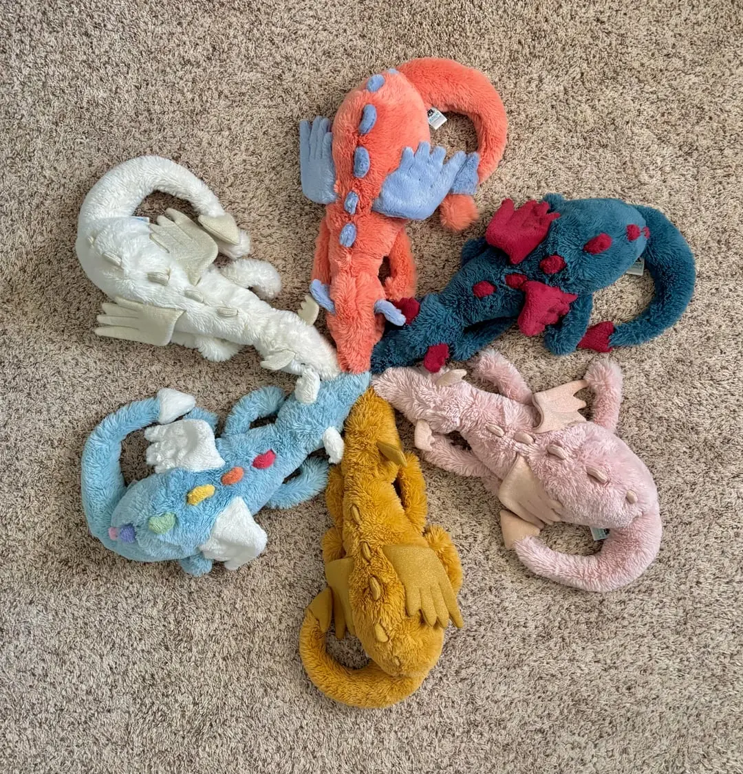 A collection (of 19.6-inch) plush toys featuring vibrant fur, shimmering wings, and soft, pleasant material—an ideal gift that offers a soothing, comforting touch for young children.