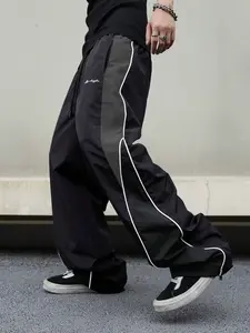 Men’s casual athletic wide-leg pants for spring and autumn, featuring a loose wide-leg fit and a drawstring hem. Suitable for retro street style, campus everyday wear, casual outings, and pairing with trendy streetwear brands.