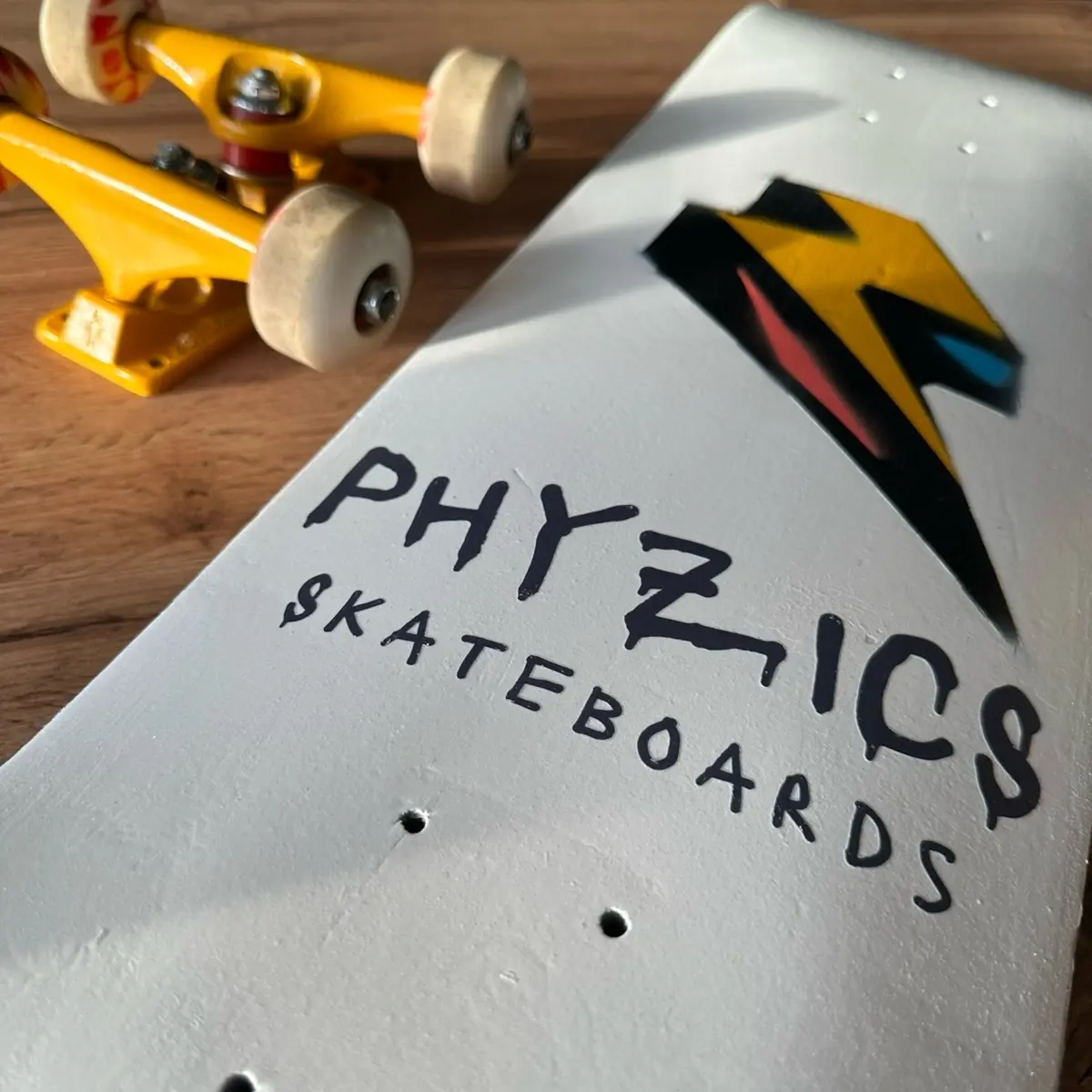Phyzics Skateboards - Pearl White Logo Skateboard Deck with Double-Nose Design