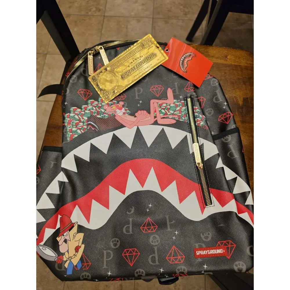 Sprayground Shark Design Backpack with Gold Tag and Red Diamond Pattern